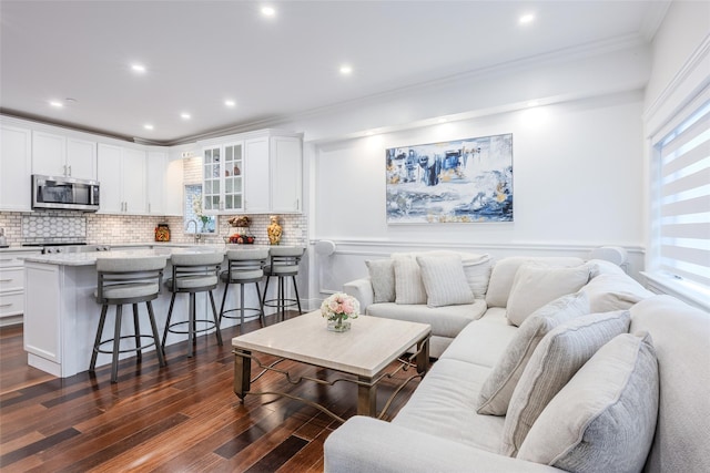 114 Atlantic Ave Unit 82, Lynbrook, NY 11563 - living area featuring crown molding, dark wood-style flooring, recessed lighting, and wainscoting