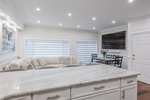 114 Atlantic Ave Unit 82, Lynbrook, NY 11563 - kitchen with a decorative wall, white cabinets, recessed lighting, ornamental molding, and dark wood-type flooring