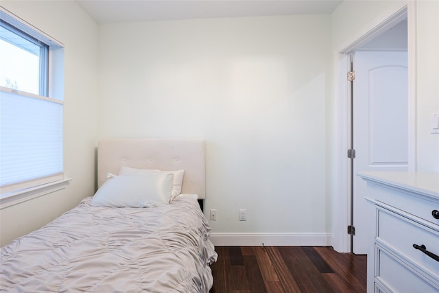 114 Atlantic Ave Unit 82, Lynbrook, NY 11563 - bedroom with dark wood-type flooring and baseboards
