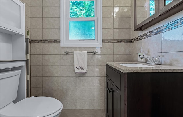 72 Harris Ave, Hewlett, NY 11557 - bathroom featuring tile walls, vanity, and healthy amount of natural light