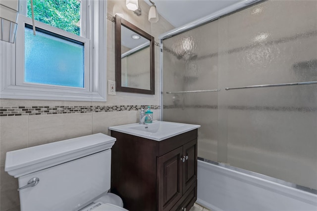 72 Harris Ave, Hewlett, NY 11557 - bathroom with vanity, enclosed tub / shower combo, and tile walls