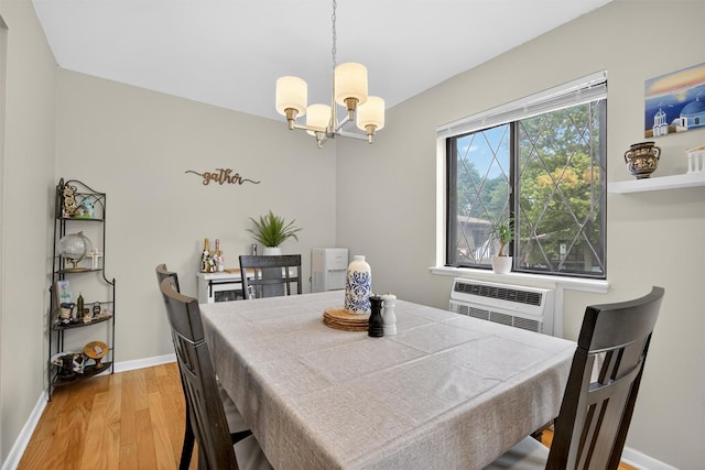 129 Main St Unit D12, Cornwall, NY 12518 - dining area with a chandelier, light wood-style flooring, and a wall unit AC