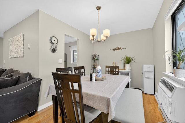 129 Main St Unit D12, Cornwall, NY 12518 - dining area with light wood-style flooring and a chandelier