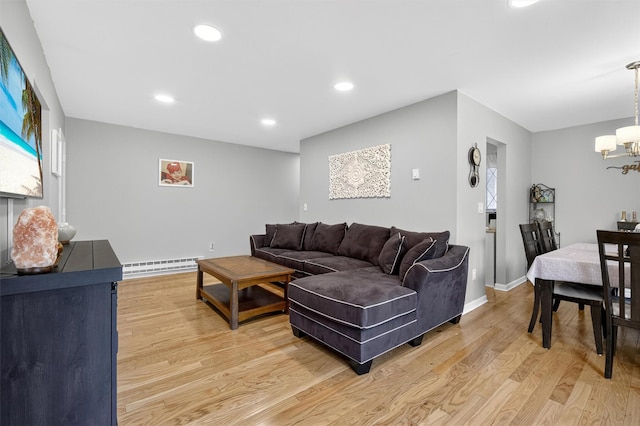 129 Main St Unit D12, Cornwall, NY 12518 - living room with a baseboard heating unit, a chandelier, light wood-style floors, and recessed lighting