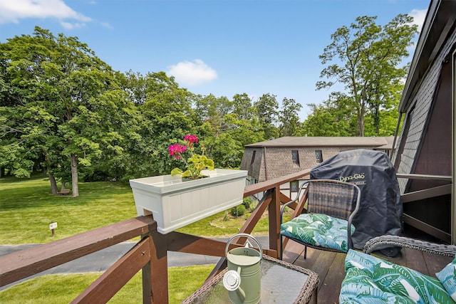 129 Main St Unit D12, Cornwall, NY 12518 - deck featuring a lawn, view of wooded area, and area for grilling