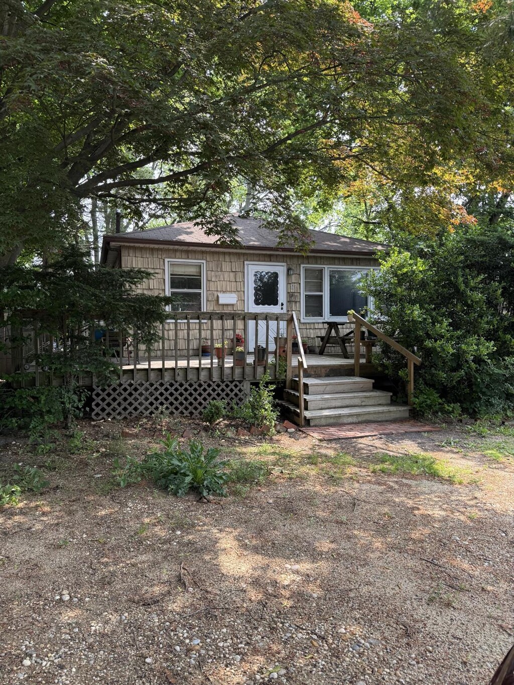 177 Washington Ave, Brentwood, NY 11717 - view of front of home with a wooden deck