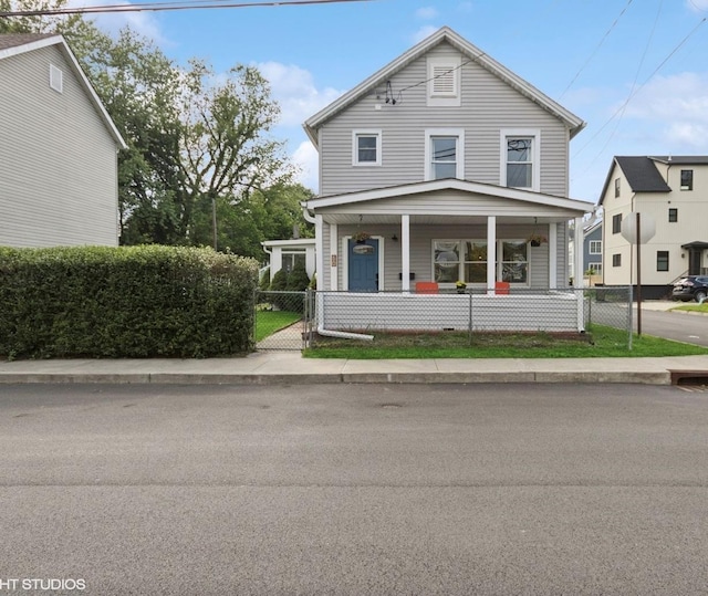 50 N Chestnut St, Beacon, NY 12508 - view of front of house featuring covered porch, a fenced front yard, and a gate