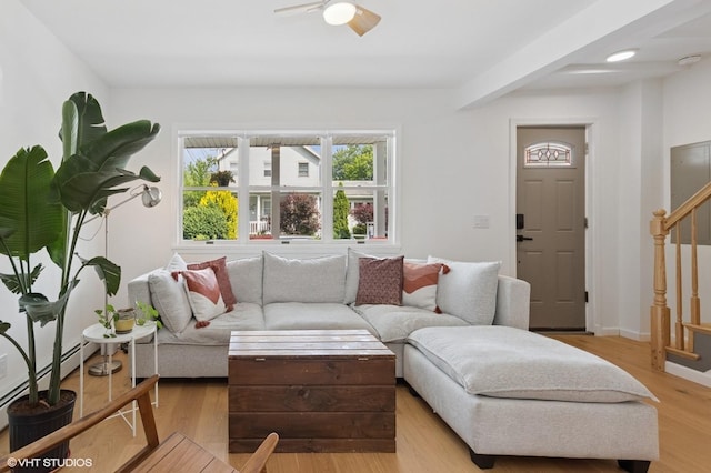 50 N Chestnut St, Beacon, NY 12508 - living area with baseboard heating, stairs, a ceiling fan, and wood finished floors