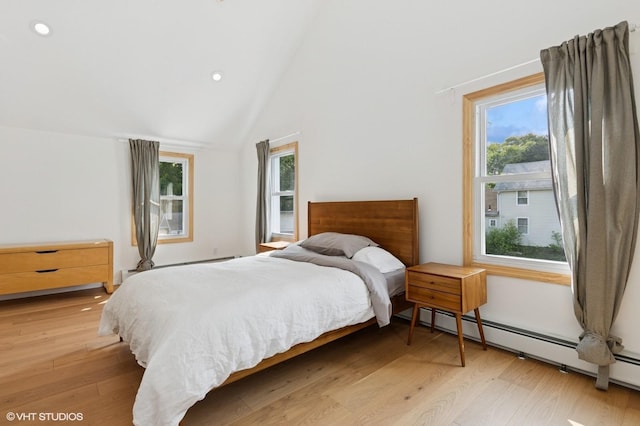 50 N Chestnut St, Beacon, NY 12508 - bedroom with a baseboard radiator, light wood finished floors, recessed lighting, and lofted ceiling