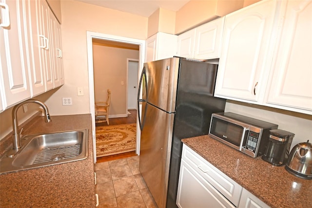 221 Middle Neck Rd Unit I-3, Great Neck, NY 11021 - kitchen featuring stainless steel appliances, white cabinetry, and light tile patterned flooring