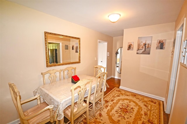 221 Middle Neck Rd Unit I-3, Great Neck, NY 11021 - dining space with baseboards and wood finished floors