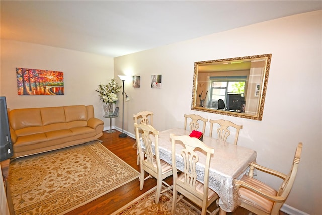 221 Middle Neck Rd Unit I-3, Great Neck, NY 11021 - dining room featuring wood finished floors and baseboards