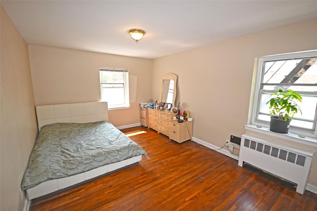 221 Middle Neck Rd Unit I-3, Great Neck, NY 11021 - bedroom with radiator and wood finished floors