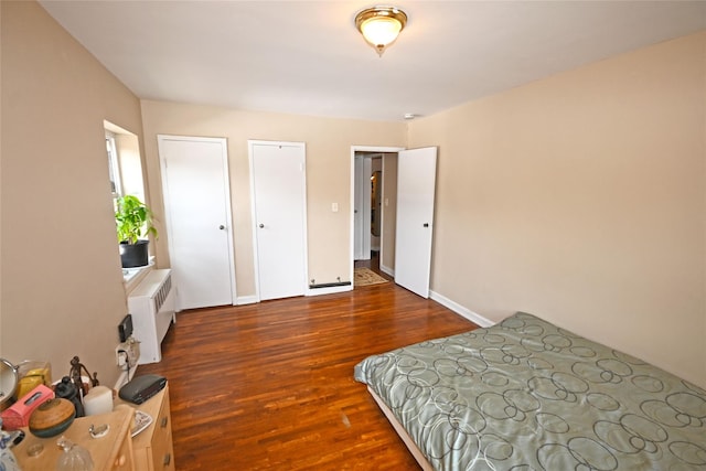 221 Middle Neck Rd Unit I-3, Great Neck, NY 11021 - bedroom featuring radiator and wood finished floors