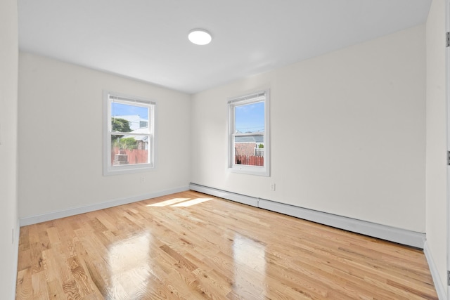 131-36 Francis Lewis Blvd, Laurelton, NY 11413 - empty room with a baseboard radiator and wood finished floors