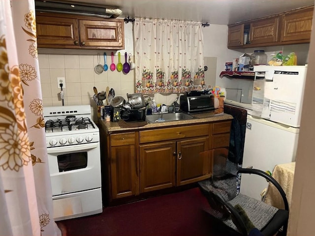 14 Matthews Pl, Brooklyn, NY 11236 - kitchen featuring white gas range, backsplash, brown cabinets, and refrigerator