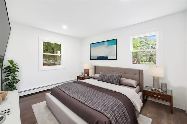 52 Broadway, Piermont, NY 10968 - bedroom with baseboard heating, wood finished floors, multiple windows, and recessed lighting