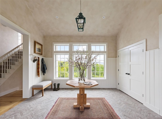 1174 Potter Mountain Rd, Gilboa, NY 12076 - foyer with stairway, a chandelier, wainscoting, and vaulted ceiling