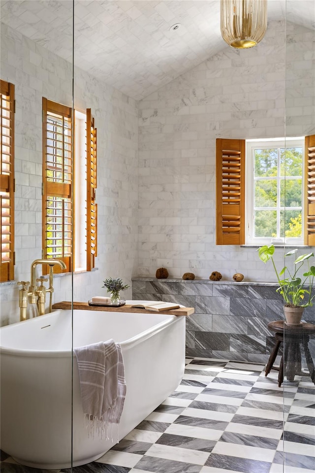 1174 Potter Mountain Rd, Gilboa, NY 12076 - full bath with plenty of natural light, tile patterned floors, a soaking tub, and vaulted ceiling
