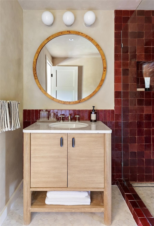 1174 Potter Mountain Rd, Gilboa, NY 12076 - full bath featuring vanity, tiled shower, tile walls, and tile patterned flooring