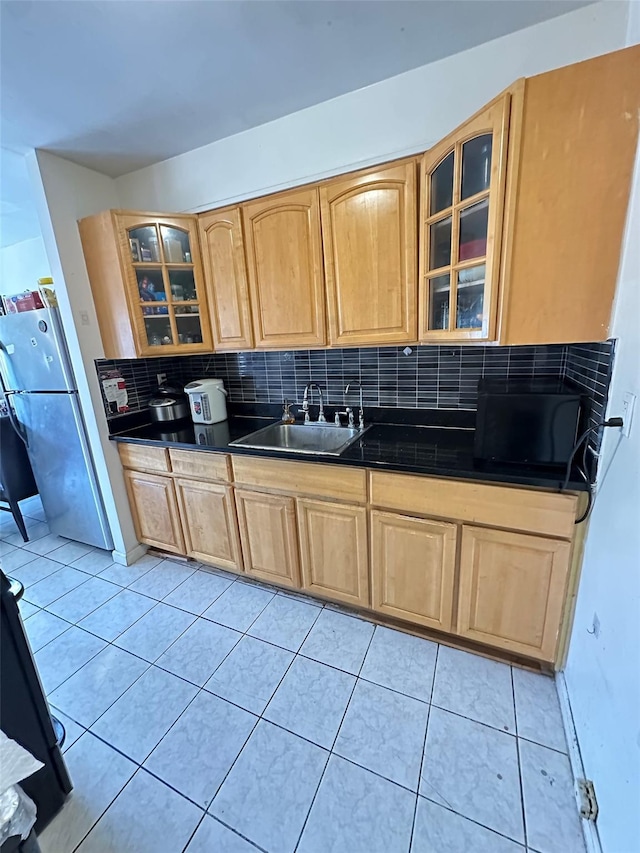 4732 207th St, Bayside, NY 11361 - kitchen featuring freestanding refrigerator, dark countertops, light brown cabinets, tasteful backsplash, and black microwave