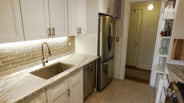 445 Gramatan Ave Unit Hc2, Mount Vernon, NY 10552 - kitchen with stainless steel appliances, white cabinets, backsplash, and light stone countertops
