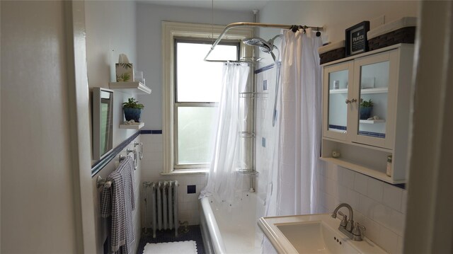 445 Gramatan Ave Unit Hc2, Mount Vernon, NY 10552 - full bathroom with radiator heating unit, tile walls, shower / tub combo with curtain, and decorative backsplash