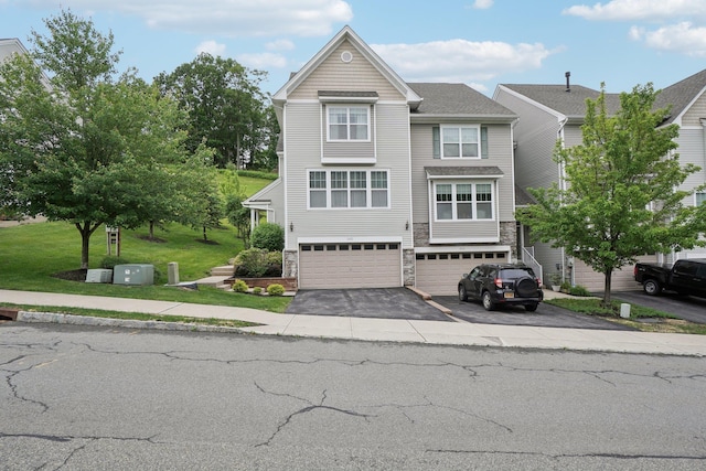 2602 Hawthorn Way, New Windsor, NY 12553 - view of front of house featuring an attached garage, stone siding, and asphalt driveway