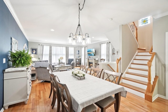 2602 Hawthorn Way, New Windsor, NY 12553 - dining room with crown molding, light wood finished floors, a chandelier, stairway, and recessed lighting