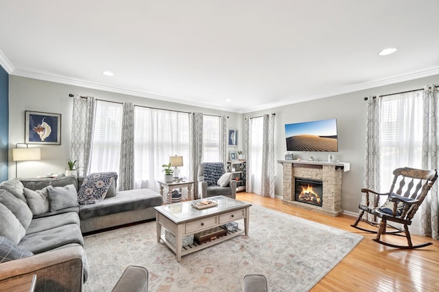 2602 Hawthorn Way, New Windsor, NY 12553 - living room featuring wood finished floors, crown molding, a stone fireplace, and recessed lighting