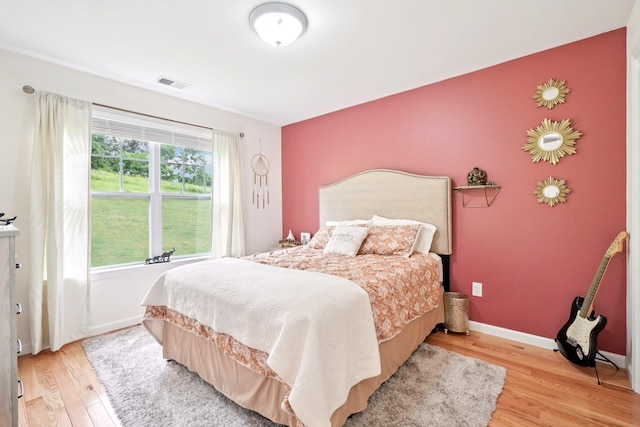 2602 Hawthorn Way, New Windsor, NY 12553 - bedroom featuring light wood finished floors and an accent wall