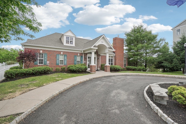 2602 Hawthorn Way, New Windsor, NY 12553 - view of front facade with brick siding, a chimney, and roof with shingles