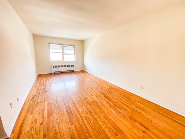1365 Crosby Ave, Bronx, NY 10461 - spare room with radiator and light wood finished floors