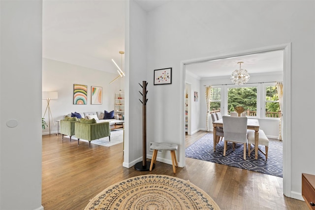 8 Sylvan Ln, Scarsdale, NY 10583 - foyer entrance with a chandelier, wood finished floors, and crown molding