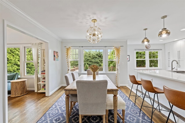 8 Sylvan Ln, Scarsdale, NY 10583 - dining room with wood finished floors, a chandelier, and ornamental molding