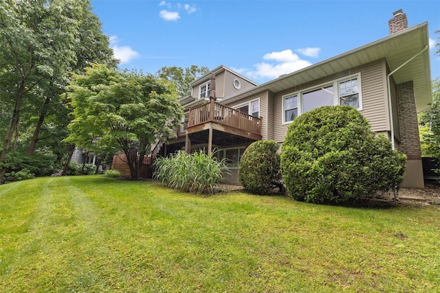 8 Sylvan Ln, Scarsdale, NY 10583 - back of house featuring a chimney, a lawn, and a deck