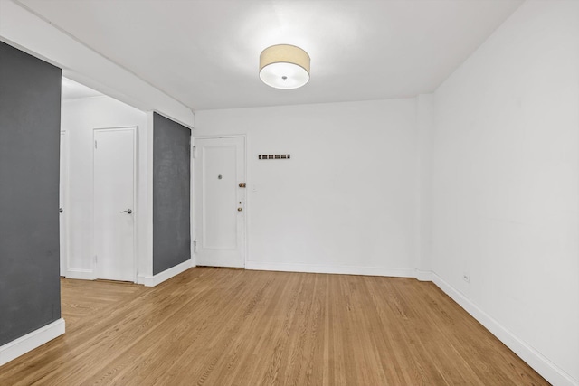 83-33 Austin St Unit 2C, Kew Gardens, NY 11415 - spare room with light wood-style flooring and baseboards