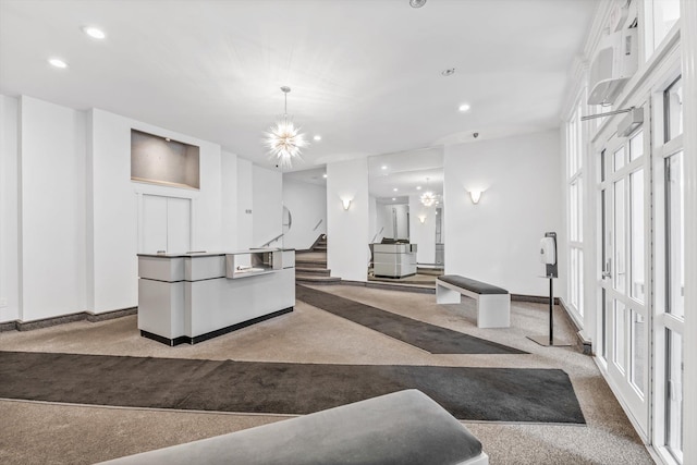 83-33 Austin St Unit 2C, Kew Gardens, NY 11415 - kitchen featuring carpet, recessed lighting, a chandelier, and white cabinets