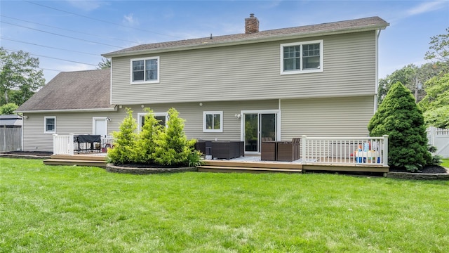55 Charm City Dr, Port Jefferson Station, NY 11776 - back of house featuring a wooden deck and a chimney