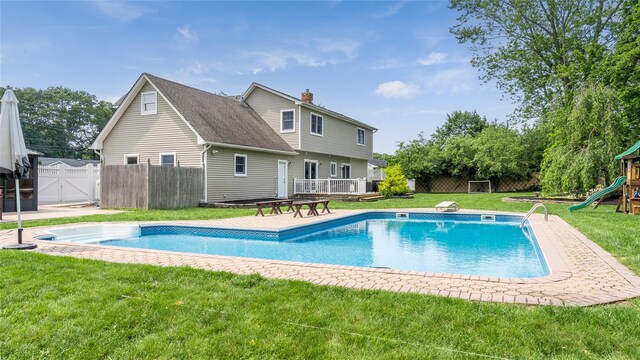 55 Charm City Dr, Port Jefferson Station, NY 11776 - view of swimming pool featuring a playground and a gate