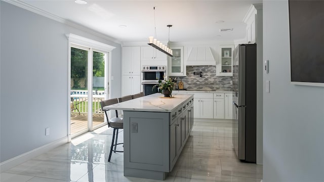 55 Charm City Dr, Port Jefferson Station, NY 11776 - kitchen with stainless steel appliances, backsplash, white cabinetry, light marble finish floors, and crown molding