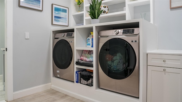 55 Charm City Dr, Port Jefferson Station, NY 11776 - laundry area with washer / dryer and light wood-style flooring