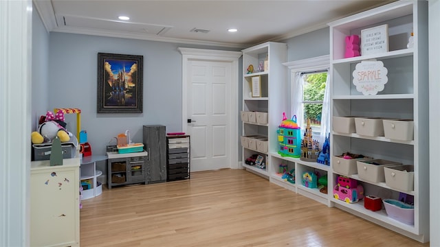 55 Charm City Dr, Port Jefferson Station, NY 11776 - game room with crown molding, wood finished floors, and recessed lighting