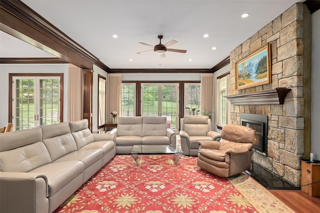 3747 Purchase St, Purchase, NY 10577 - living area with crown molding, a ceiling fan, plenty of natural light, recessed lighting, and a stone fireplace
