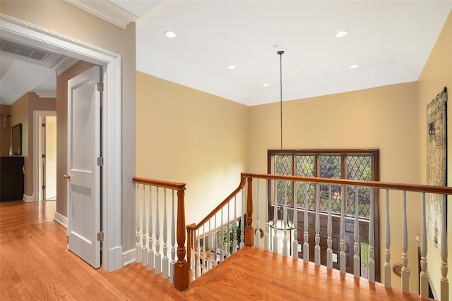 3747 Purchase St, Purchase, NY 10577 - corridor with wood finished floors, recessed lighting, an upstairs landing, and ornamental molding