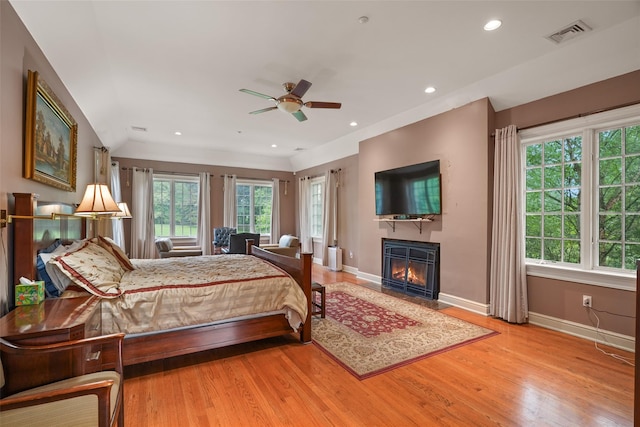 3747 Purchase St, Purchase, NY 10577 - bedroom with wood finished floors, a glass covered fireplace, and recessed lighting