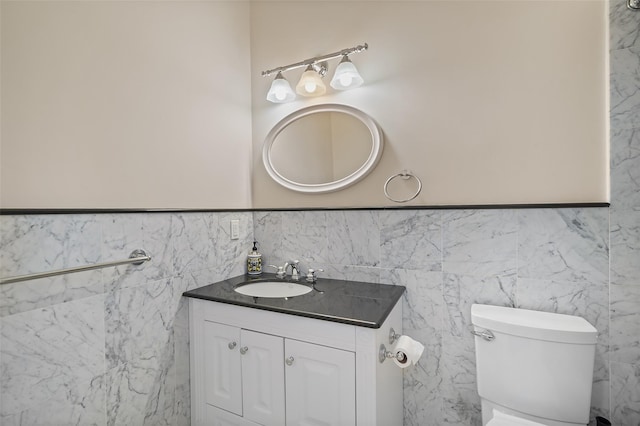 3747 Purchase St, Purchase, NY 10577 - bathroom with vanity, tile walls, and wainscoting