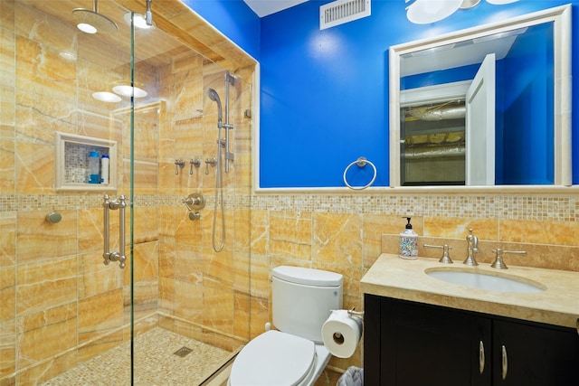 3747 Purchase St, Purchase, NY 10577 - bathroom featuring vanity, a shower stall, and tile walls