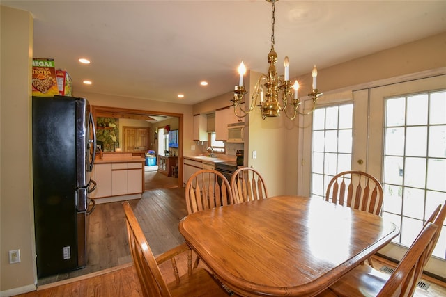 805 Canal Rd, Mount Sinai, NY 11766 - dining room featuring a chandelier, light wood-style flooring, and recessed lighting