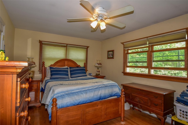 805 Canal Rd, Mount Sinai, NY 11766 - bedroom featuring wood finished floors, a ceiling fan, and baseboard heating